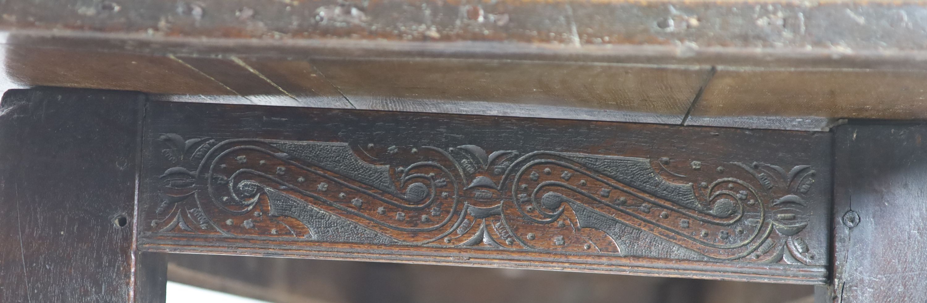 A Charles I oak refectory table, possibly West Country, having three-plank top H 74cm. W 220cm. D 76cm.